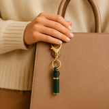 Olfa Originals refillable perfume bag charm attached to a handbag