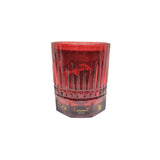 Caramel Oud candle in a red glass holder