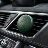 Luxury Oud car perfume diffuser attached to a car air vent